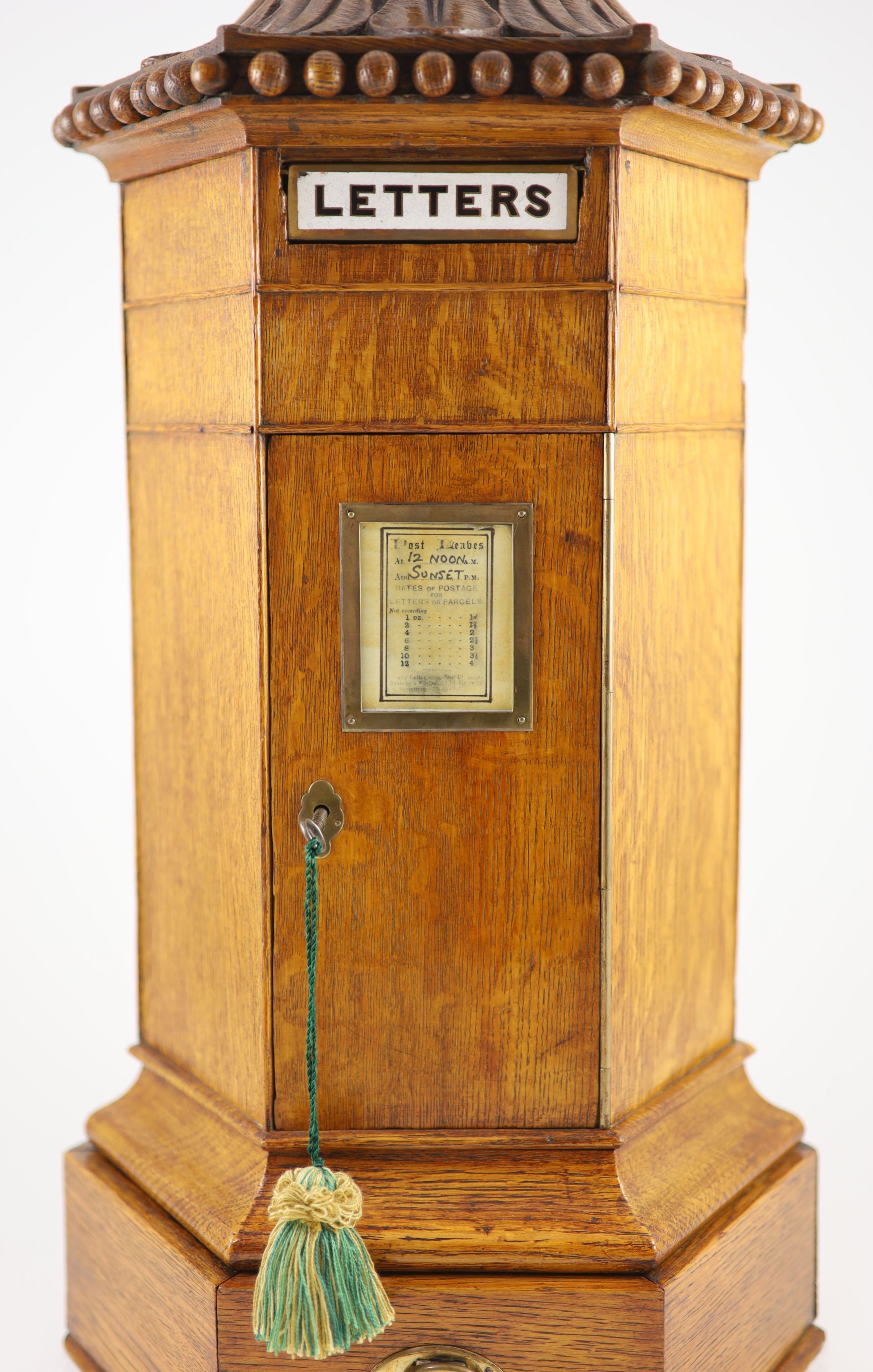 A Victorian oak hexagonal letter box, retailed by Walter Thornhill of 144 New Bond Street H 67cm. W 31cm. D. 26cm.